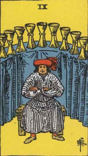 A cross-armed man in a medieval merchant's hat sits on a wooden bench in front of a draped shelf of nine golden cups. The Nine of Cups: Jupiter in Pisces explores the material things that bring us happiness and the spiritual necessity of pleasure. 