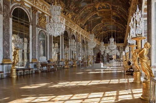 Light pouring in the windows of the opulent Hall of mirrors at Versailles